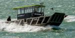 ID 14076 Sea Cleaners Phil Warren II negotiating the choppy waters of Auckland's Waitemata Habour.
Sea Cleaners is a non-profit organisation aiming to clean up New Zealand's coastal marine environment. 